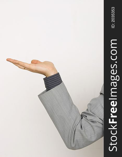 Man's hand in a business suite positioned to hold something. Suitable for superimposing objects onto man's palm.