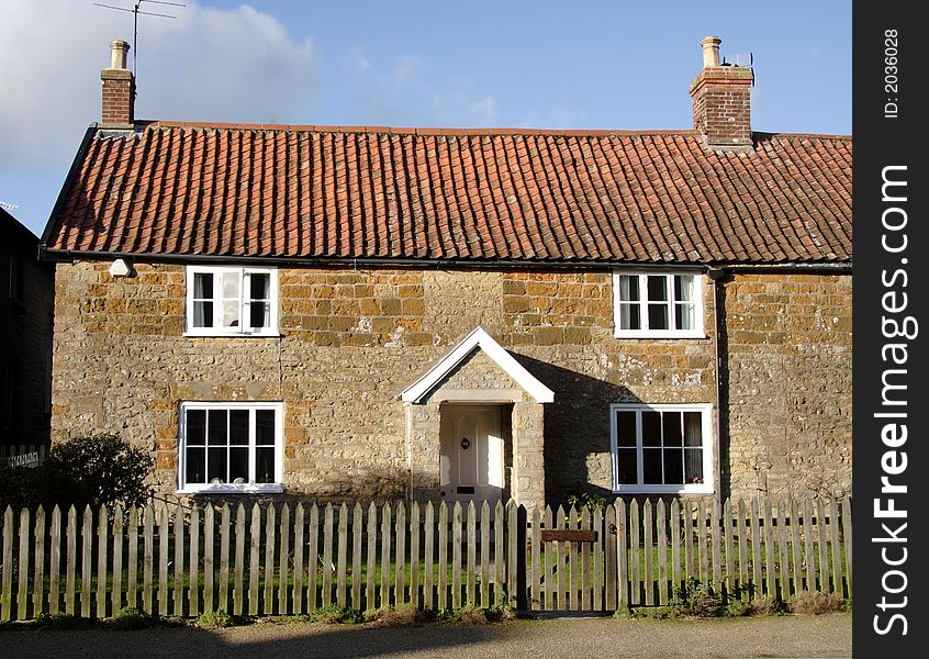 Winter sunshine on a Natural Stone English Village Cottage