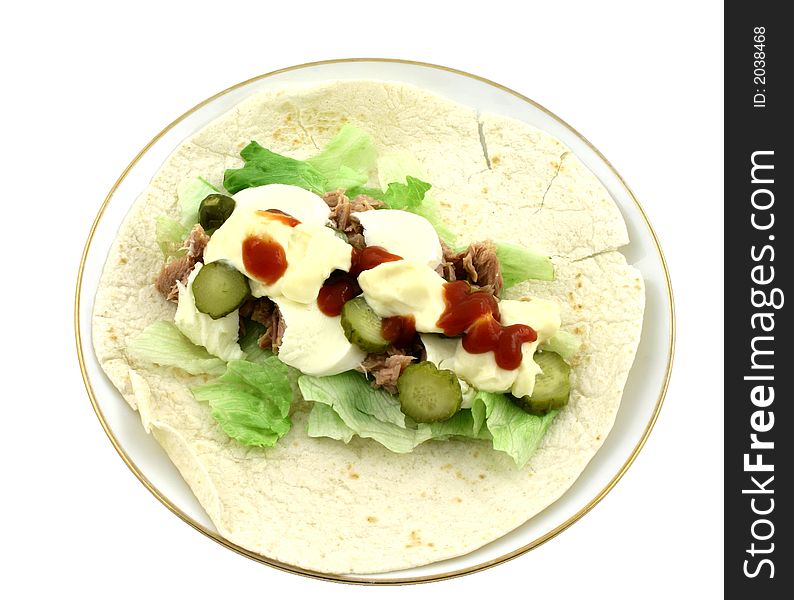 Top view at tasty tuna wrap with fresh ingredients