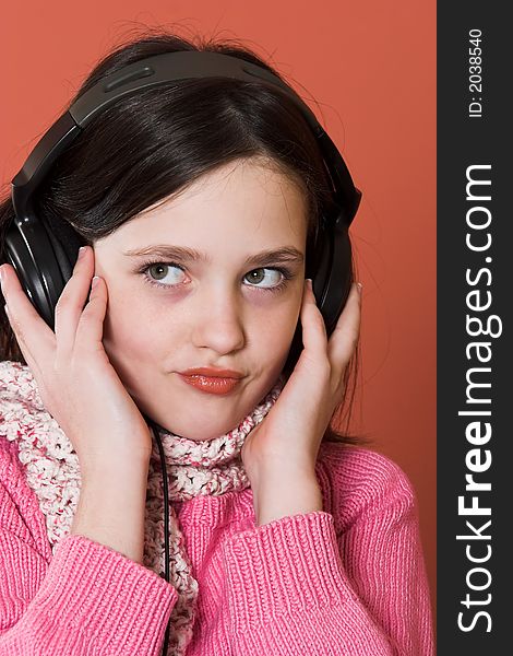 Pretty girl listening music in headphones