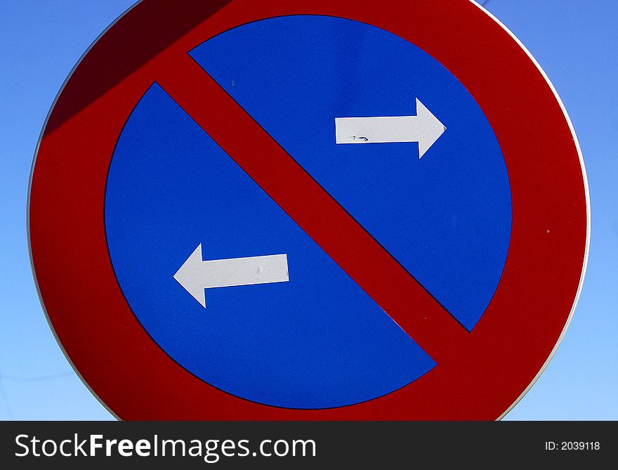 Prohibition sign with a circle form and white arrows. Prohibition sign with a circle form and white arrows