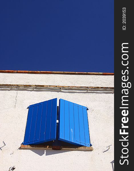 Typical blue window in the town of Cadaques, Catalonia, Spain, Europe. Typical blue window in the town of Cadaques, Catalonia, Spain, Europe