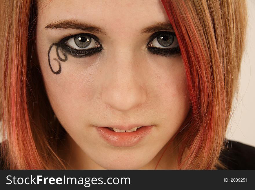 A picture of teenager with decorative make-up. A picture of teenager with decorative make-up