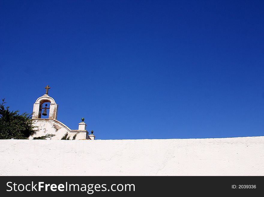 Tower with bell of a church in the town of Cadaques, Catalonia, Spain, Europe