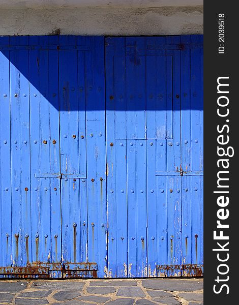 Blue wooden door of the town of Cadaques, Catalonia, Spain, Europe