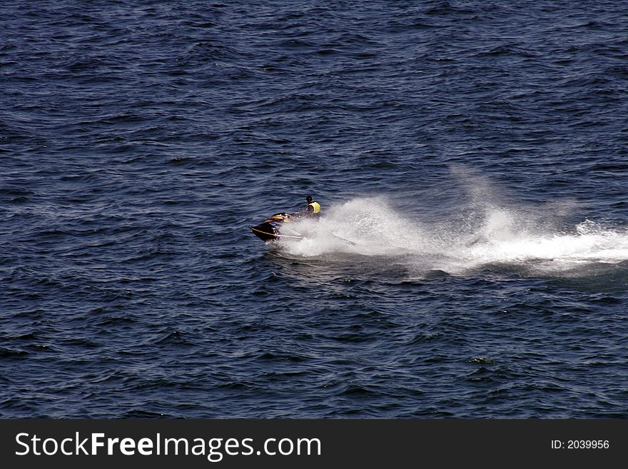 JetSki Rider On A Water Bike, Blue Ocean Surface On A Summer Day, Outdoor