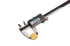 Calipers And Coin Stock Photography