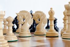 Chess Pieces On Wood Board Stock Photo