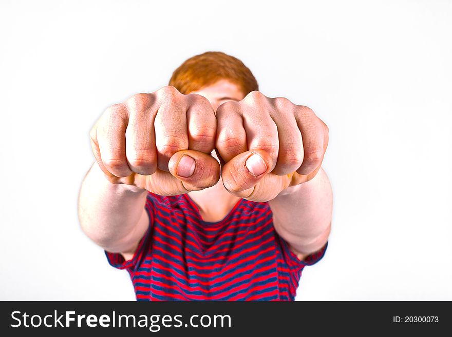 Cute boy with fist isolated on white background