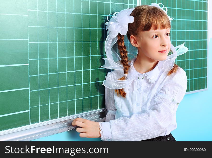 Portrait of a pretty schoolgirl in a classroom. Portrait of a pretty schoolgirl in a classroom.