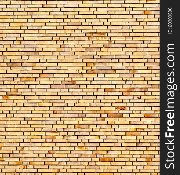 Pattern of beige yellow brick wall