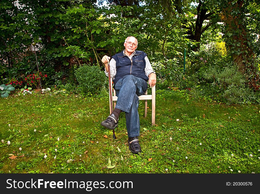 Portrait Of Elderly Man Sitting