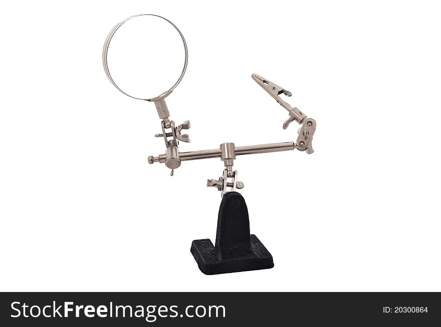 Magnifying glass with a clamp on the stand on a white background