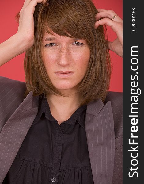 Portrait of sad businesswoman over red background