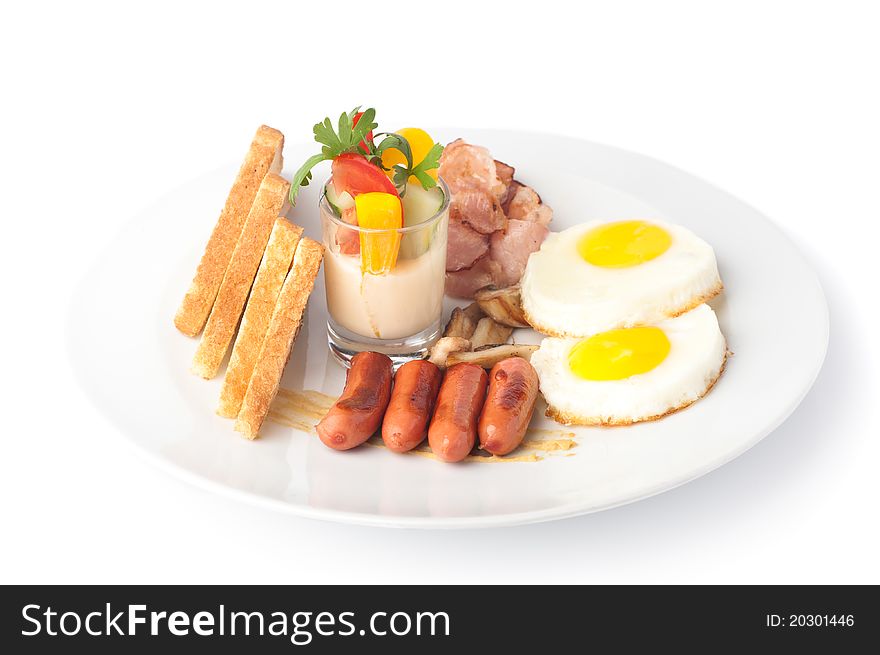 A plate with fried eggs, sausages, bread and sauce with vegetables. A plate with fried eggs, sausages, bread and sauce with vegetables