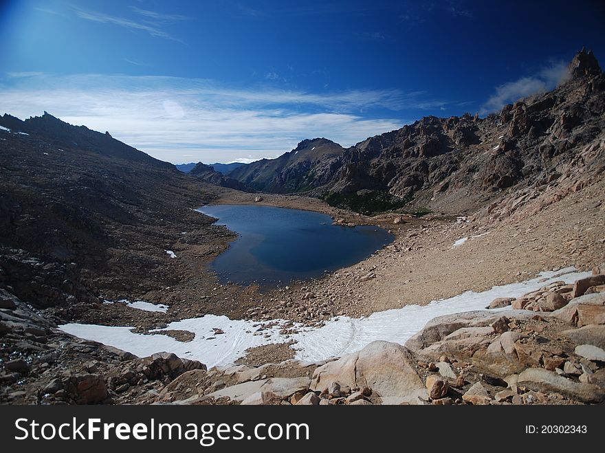 Dark lake and mountains landscape