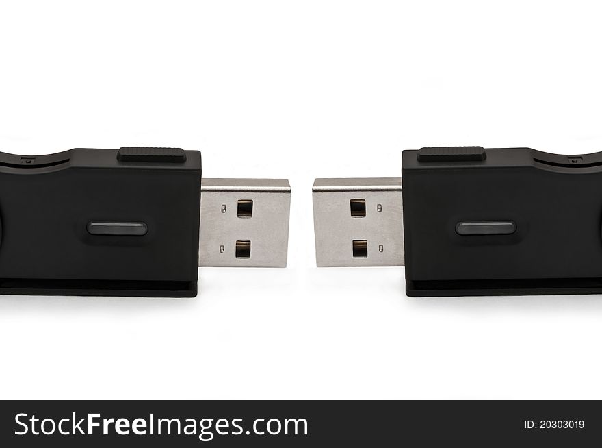 Close and low level capturing two usb sd adaptors arranged over white