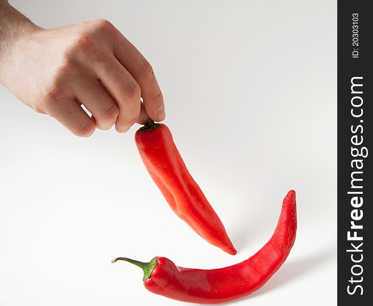 Red chilli hot peppers hand fingers