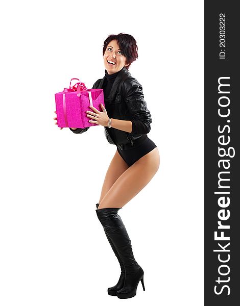 Beauty young woman in leather jacket and high heels boots holding a red giftbox. Beauty young woman in leather jacket and high heels boots holding a red giftbox