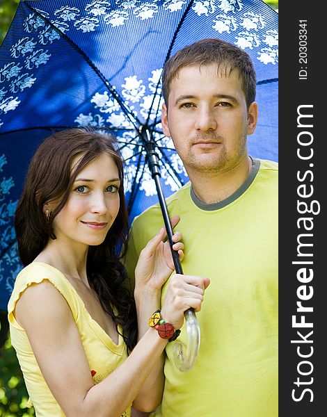 Husband And Wife Under Umbrella