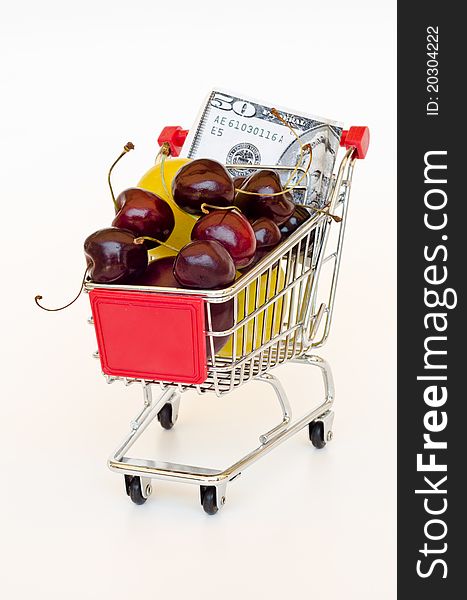 Red shopping cart with fruits and dollar. Red shopping cart with fruits and dollar