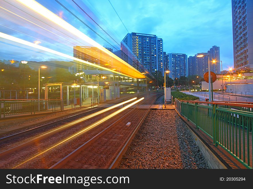 Traffic in Hong Kong at night. Light rail.