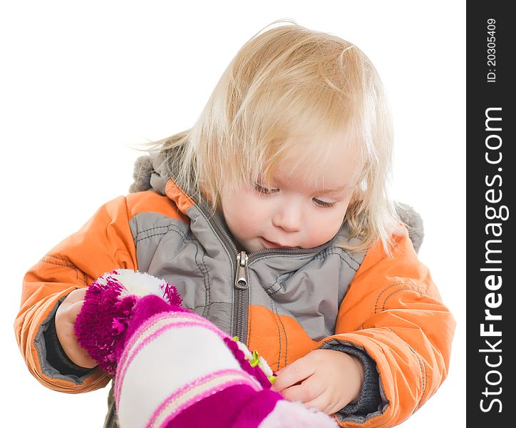 Adorable toddler girl dressing winter jacket and hat. Adorable toddler girl dressing winter jacket and hat