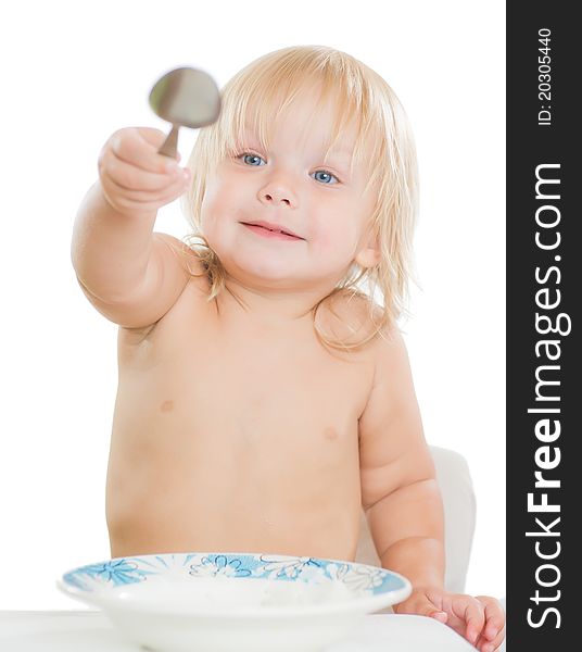 Adorable toddler girl eat porridge