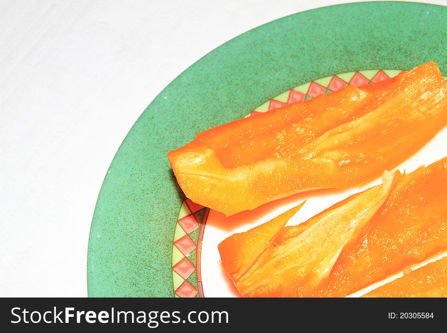 Bell pepper cut into slices on a plate