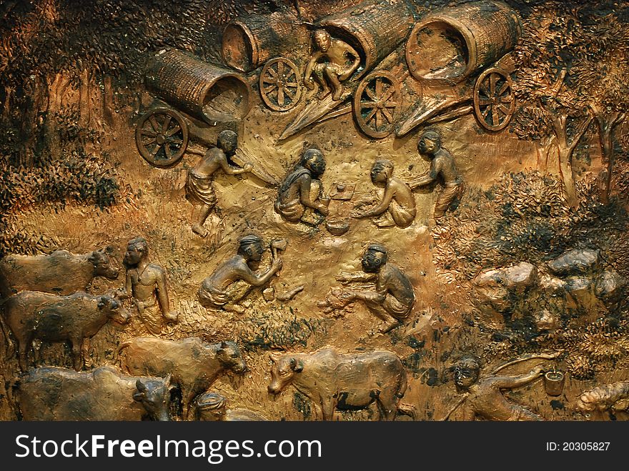 Stucco sculptures wall, The lives of Thai people.