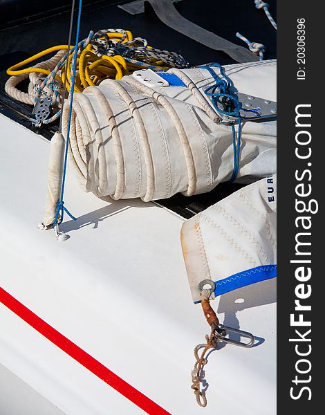 Sailing boat detail with sails and ropes. Sailing boat detail with sails and ropes