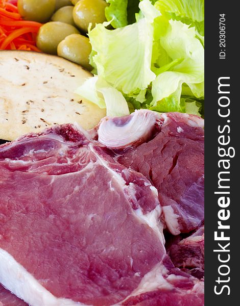 Steak with raw vegetables, cooking and gastronomy. Steak with raw vegetables, cooking and gastronomy