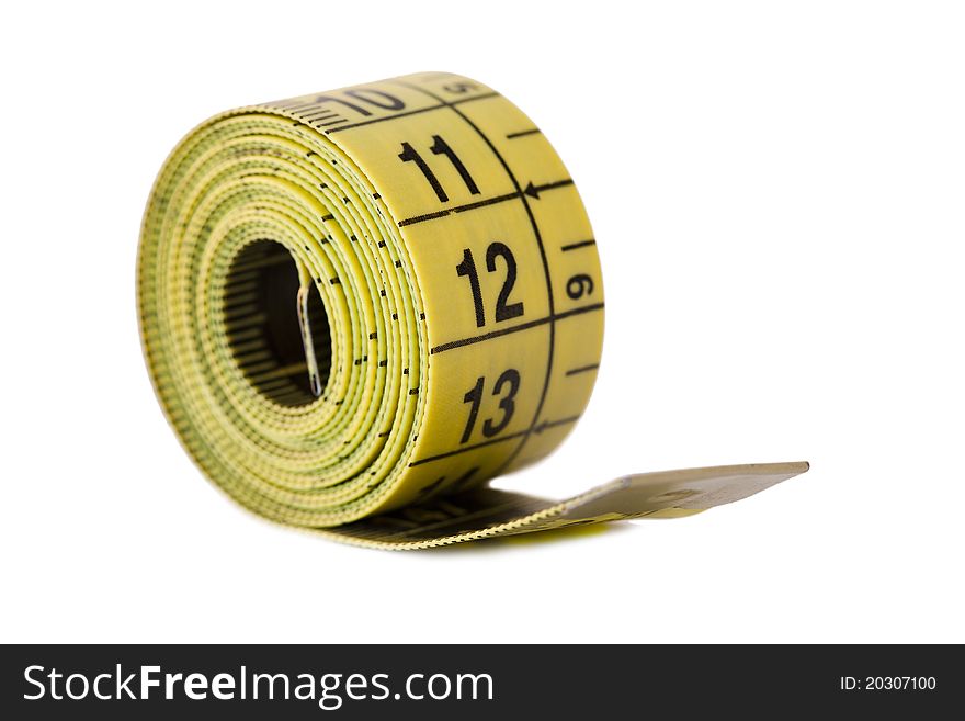 The dressmaker's tape measure isolated on white background. The dressmaker's tape measure isolated on white background