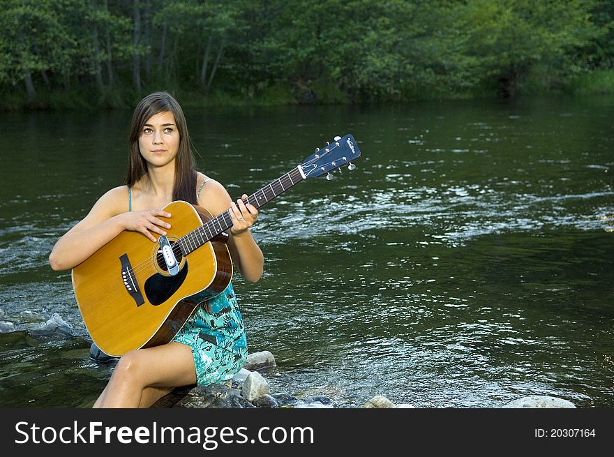 Young Woman Playing Guitar