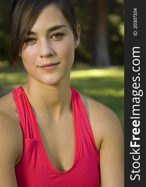 Young woman runner working out in a park