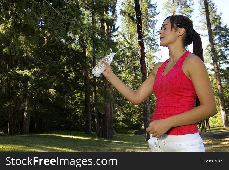 Young woman runner working out in a park