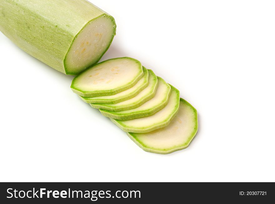 Cut fresh zucchini on a white background