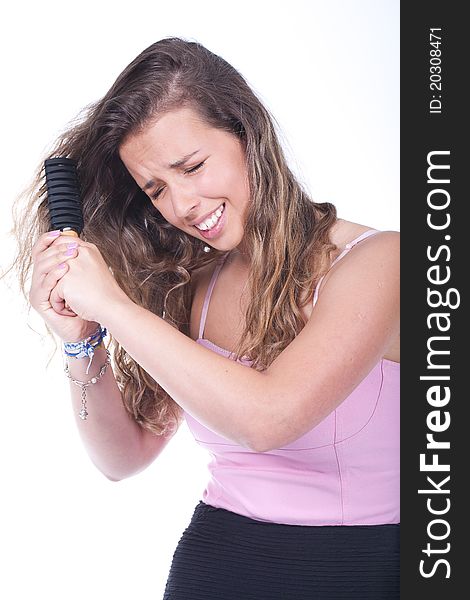 Woman having trouble brushing her hair and feeling pain. Woman having trouble brushing her hair and feeling pain