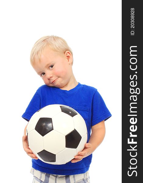 Little boy in a blue shirt with a soccer ball. Little boy in a blue shirt with a soccer ball