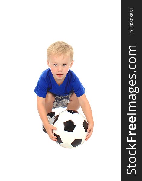 Little boy in a blue shirt with a soccer ball. Little boy in a blue shirt with a soccer ball