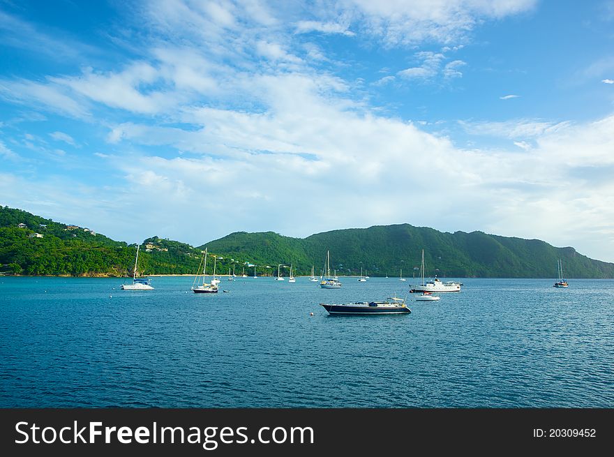 Boats floating in a Caribbean harbor. Boats floating in a Caribbean harbor.