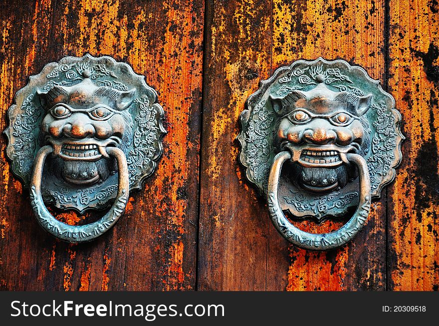 Traditional bronze knocker on door