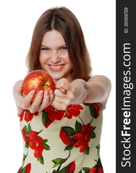 The girl with an apple isolated on white background