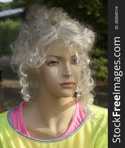 Head of an old damaged shop window doll