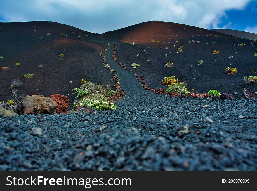 Hiking trail with lava rocks on the island of La Palma. Hiking trail with lava rocks on the island of La Palma.