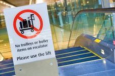 Warning Sign Before Escalator Royalty Free Stock Image