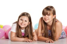 Two Sisters Lying On The Floor With Balloons Stock Image Two Sisters Lying On The Floor With Balloons Stock Image