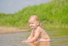 Adorable Baby Sit In River And Play With Sand Royalty Free Stock Image Adorable Baby Sit In River And Play With Sand Royalty Free Stock Image
