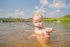 Adorable Baby Sit In River And Play With Wood Royalty Free Stock Image Adorable Baby Sit In River And Play With Wood Royalty Free Stock Image