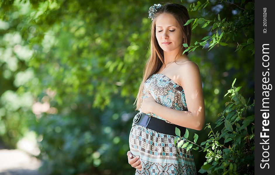 Beautiful and elegance pregnant woman outdoors. Beautiful and elegance pregnant woman outdoors